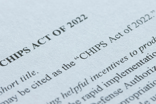 Closeup of the documents of the CHIPS Act of 2022. The U.S. Congress passed the legislation in July 2022 to strengthen domestic semiconductor manufacturing, design and research, fortify the economy and national security, and reinforce America’s chip supply chains.