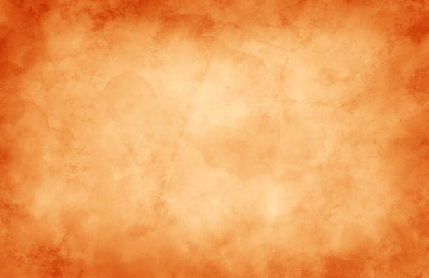 Old orange paper parchment background with vintage texture grunge, antique autumn color burnt orange border stock photo
