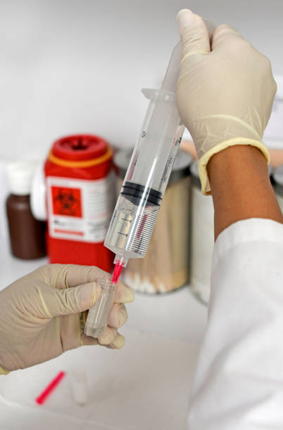 istock Doctor Drawing Up Stem Cells into Syringe 1413526822