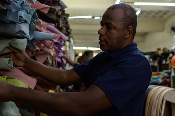 istock Blue collar workers in a leather shop 1413529053