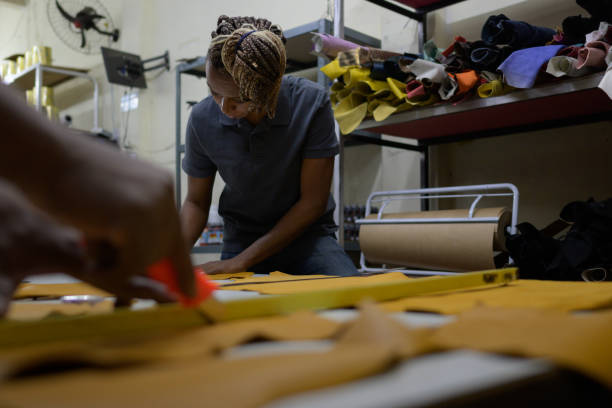 istock Blue collar workers in a leather shop 1413529153