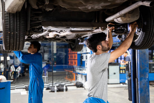 istock Two mechanic was checking the car suspension. 1413530630