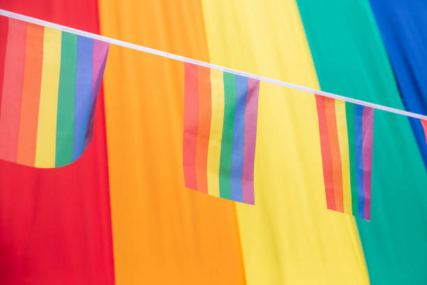 istock Full frame Gay Pride background with rainbow flag and bunting 1413531745