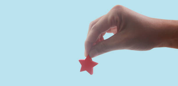 istock Rise on increasing five stars in human hand, Increase rating evaluation 1413531756