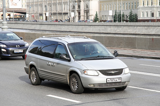 Moscow, Russia - June 3, 2012: Grey minivan Chrysler Town & Country in the city street.