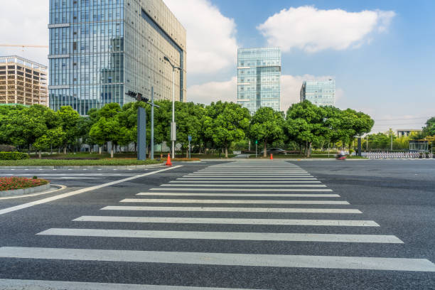 istock empty road with zebra crossing and skyscrapers in modern city 1413538209