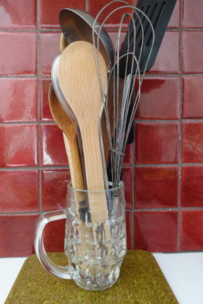 istock Various kitchen utensils  Wooden spoons Spatula Whisk Ladle  Kitchen worktop 1413539190