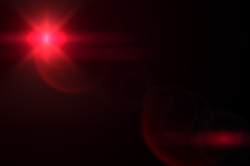 Lens Flare, red Flare on black background. Optical Flare effect illustration. lens effects for overlay designs or screen blending mode. Abstract sun burst, digital flare, iridescent glare