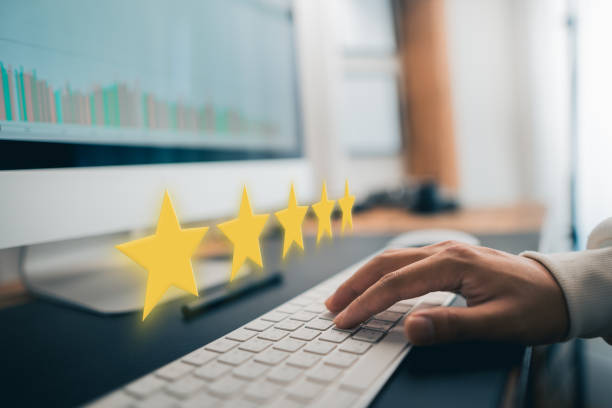 istock Hand and Phone With Five Star Rating 1413540594