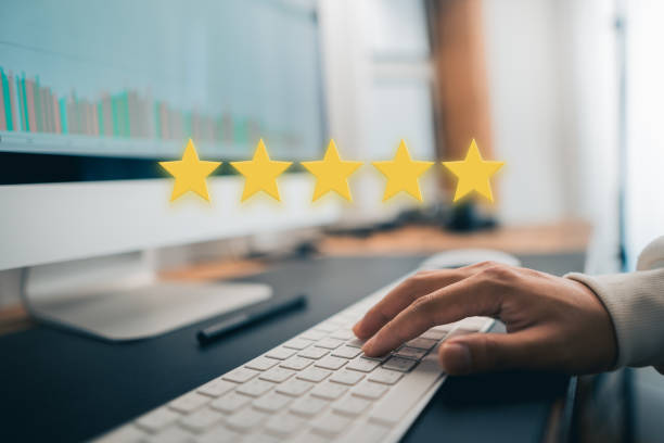 istock Hand and Phone With Five Star Rating 1413540603