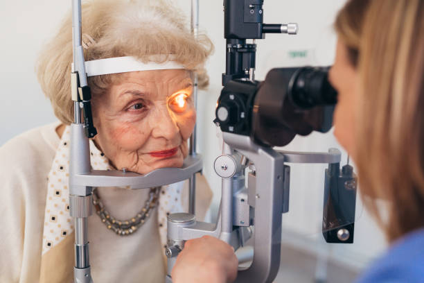 istock senior woman checking eyesight 1413541555