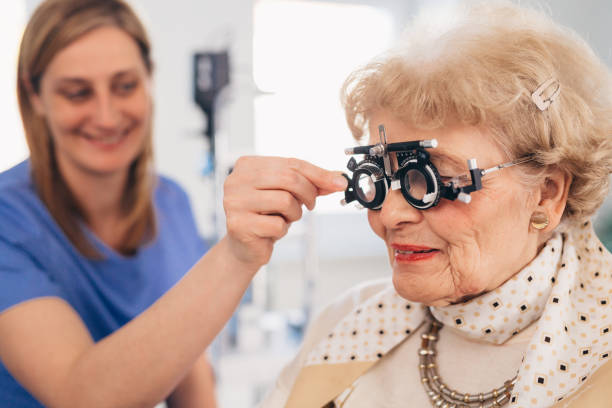 istock senior woman checking eyesight 1413541566