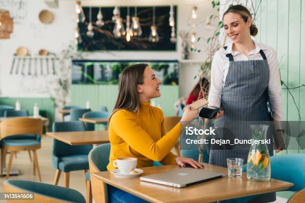 Woma In Restaurant Stock Photo - Download Image Now - Mobile Payment, Paying, Restaurant