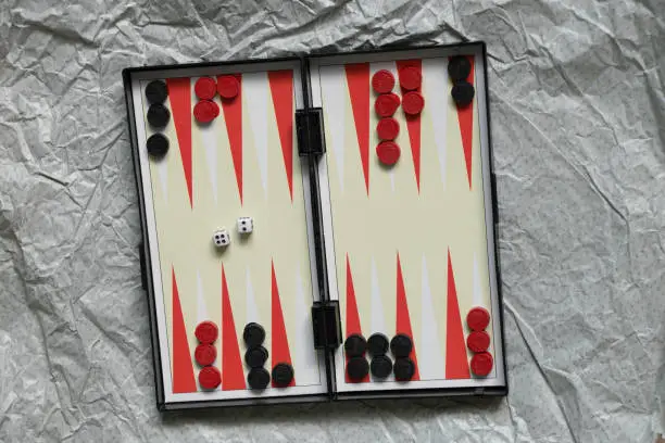 backgammon board game stands on paper on the table ,hobby