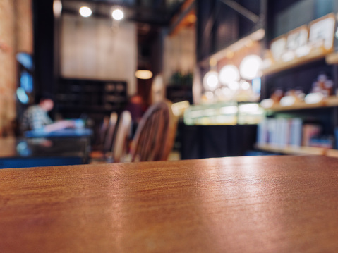 Table top in restaurant Cafe with People Blur background