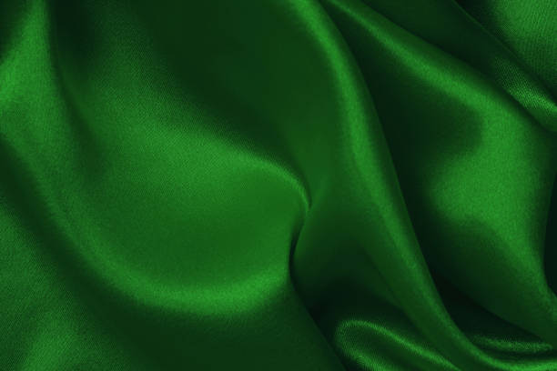 istock Dark green fabric cloth texture for background and design art work, beautiful crumpled pattern of silk or linen. 1413546621