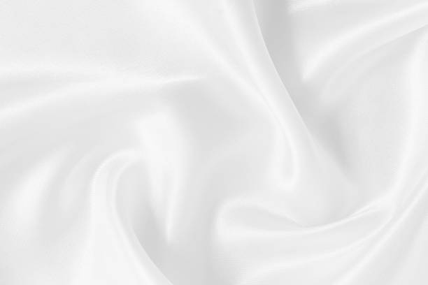 istock White fabric texture for background and design, beautiful pattern of silk or linen. 1413547182