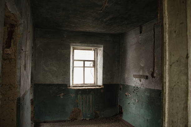 istock old abandoned one-story building dark without windows and doors, destroyed building 1413549106