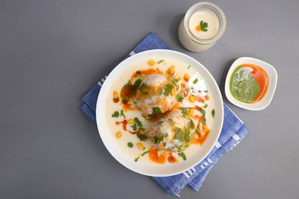 istock Dahi Bhalla or Dahi Vada is a type of chaat dish from India. It is prepared by soaking urad dal vadas in creamy yogurt with green and red chutney. Tricolor dish. Indian Tiranga Flag colors food. 1413549160