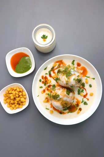 Dahi Bhalla or Dahi Vada is a type of chaat dish from India. It is prepared by soaking urad dal vadas in creamy yogurt with green and red chutney. Tricolor dish. Indian Tiranga Flag colors food.