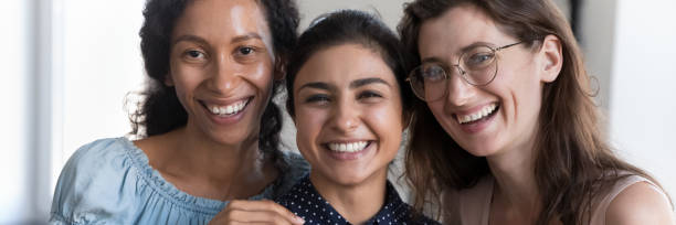 istock Horizontal photo three laughing multi ethnic women, cropped portrait 1413552415