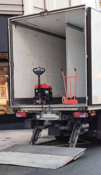 istock Semi-trailer truck unloading goods at downtown 1413552608