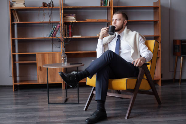 istock Happy confident business man drinking coffee 1413553262