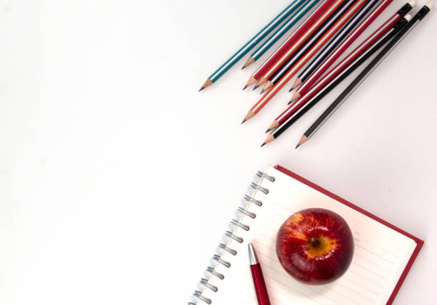 Notepad, pencils and paper clips. Back to school concept.