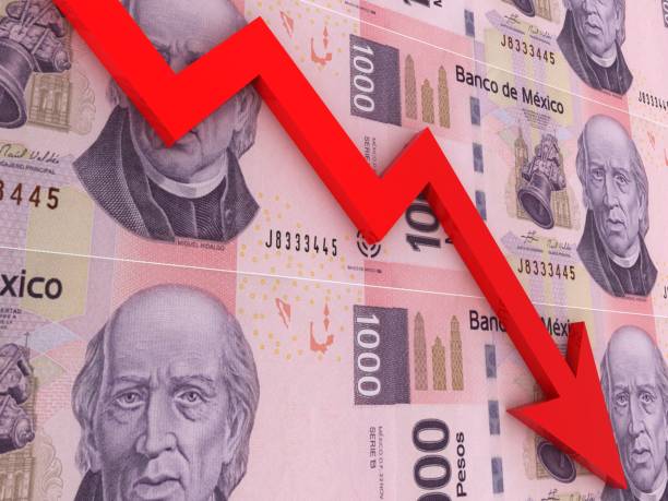 istock Mexican money peso falling finance crisis 1413553859