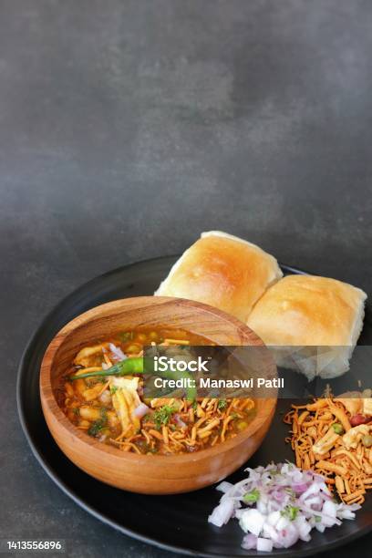 Spicy Misal Pav Or Usal Pav Is A Traditional Snack Or Chaat Food From Maharashtra India Served With Chopped Onion Lemon Wedges And Farsan Selective Focus With Copy Space Stock Photo - Download Image Now
