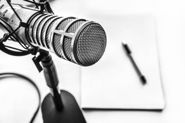 istock Professional microphone and blank sheet of paper 1413560343