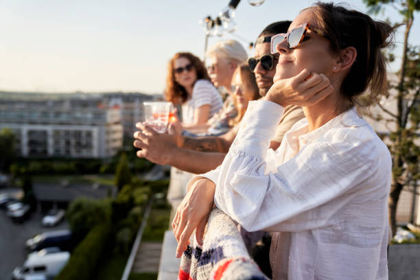 Multi ethnicity friends at the rooftop party in summer day