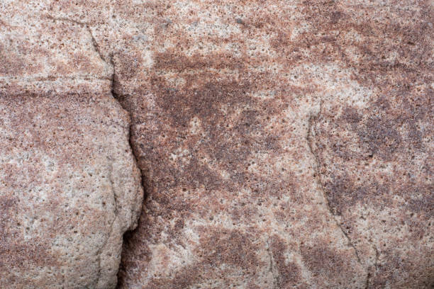 istock Surface texture of brown stone, rock. Crack in stone. 1413566505