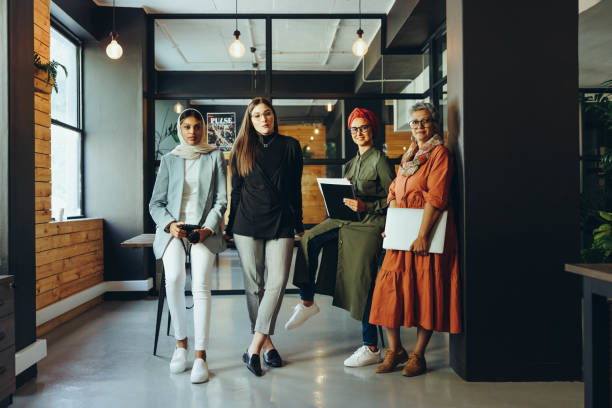 istock Creative female designers looking at the camera in an office 1413566566