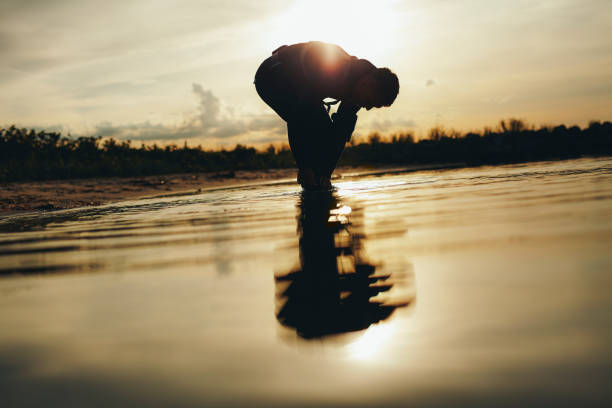 istock Man going for a dive in the ocean 1413566955