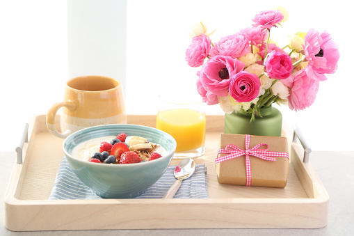 Flowers and gift with breakfast