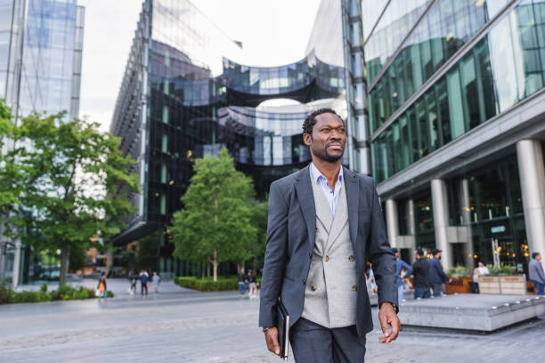 istock Stylish Black Man Walking In A Financial District 1413575241