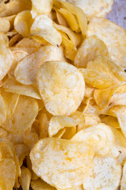 istock scattered potato chips with natural spices 1413577314
