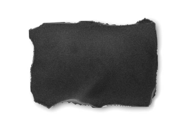 istock Black burnt paper on a white background. Design elements or portfolio. Copy space. Isolated on white 1413577867