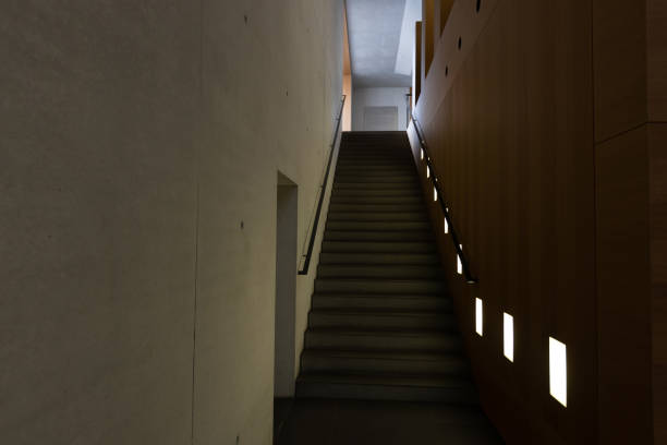 istock Modern stairs in dark interior design 1413578071