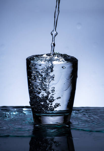 istock The image of pouring drinking water, into a glass, 1413578892