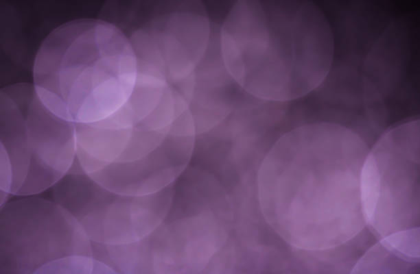 Light abstract dark bokeh christmas circle color glitter blurred black background