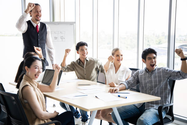 istock Team of business people doing happy gestures. 1413579019