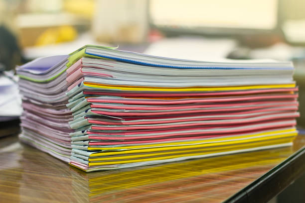 istock close up stacking of office working document,pile of documents on 1413579084