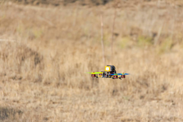 istock Flying quadcopter drone near the ground. 1413579190
