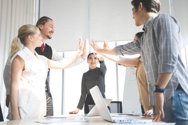 istock Success of group business people with join hands. 1413579227