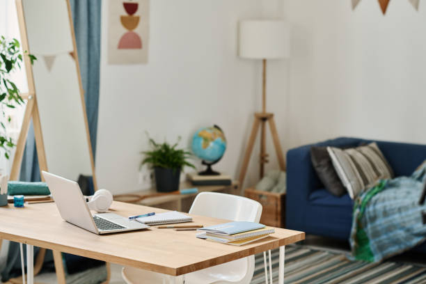istock Desk with laptop in the room 1413582159