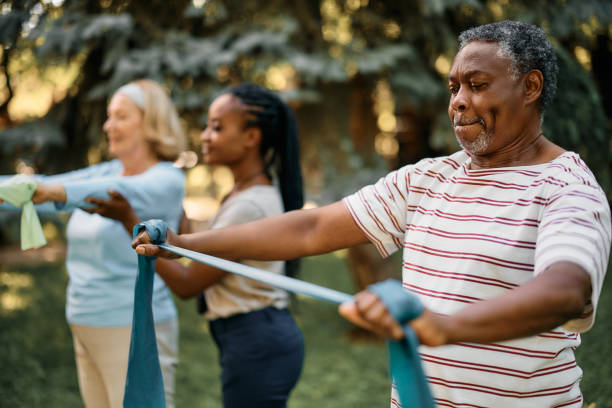 black-senior-man-using-resistance-band-during-exercise-class-in-backyard-of-a-nursing-home.jpg?s=612x612&w=0&k=20&c=TPpA69g5aFwC4sKLLK4HYOrFE17-ZNgGAeFcWYEmDCs=