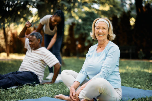istock Happy senior woman having exercise class in nature and looking at camera. 1413584073