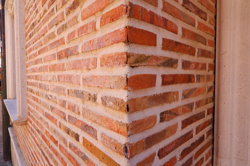 Red brick surface texture in a wall